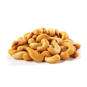Pile of roasted cashews on a white background close up stack of curved nuts