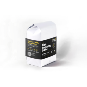 Coffee1kgDecaf2png Coffee the Bible White paper bag with a black label reading Bible Translating Coffee and Support Bible Translation as a novelty coffee product packaging