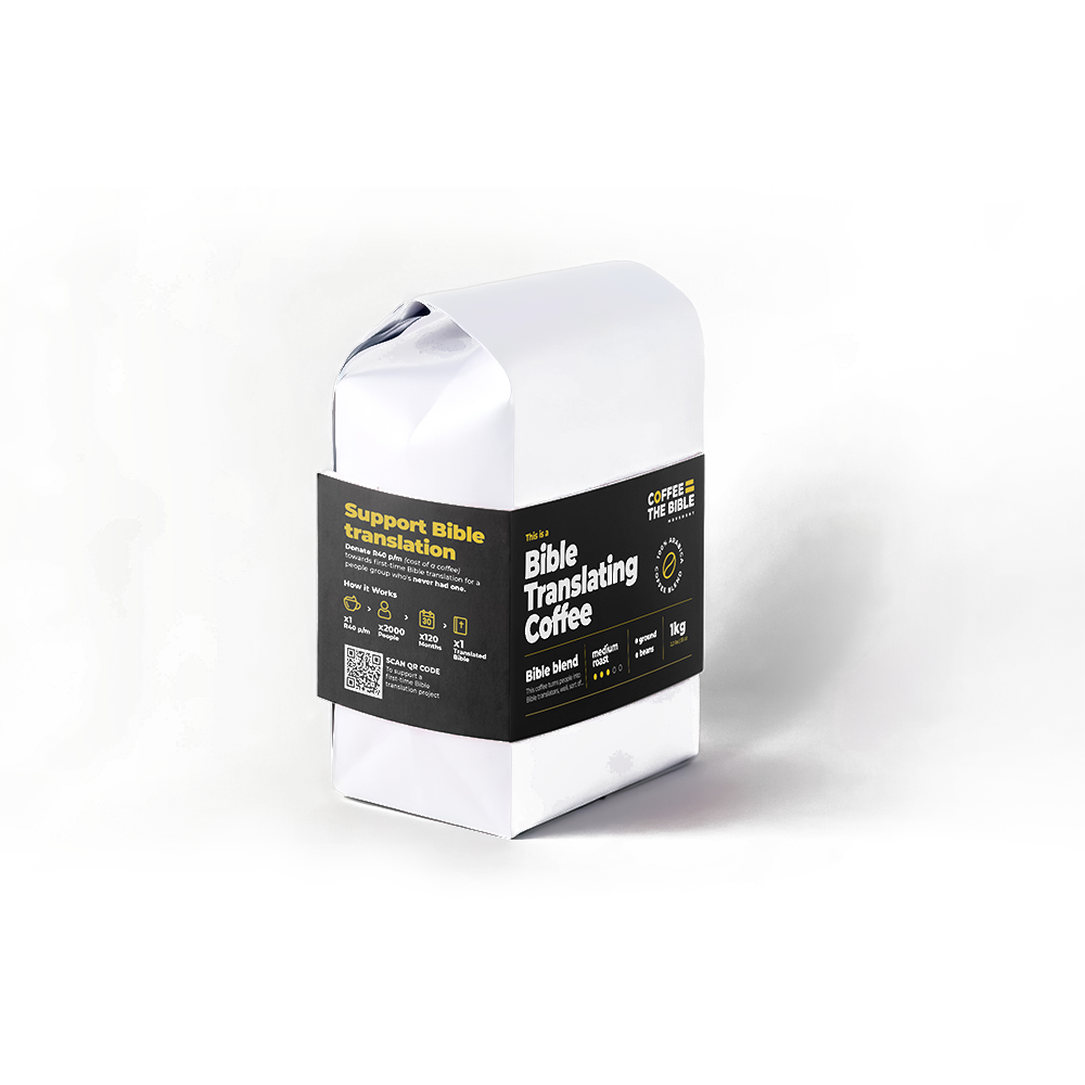 Coffee1kgDecaf2png Coffee the Bible White paper bag with a black label reading Bible Translating Coffee and Support Bible Translation as a novelty coffee product packaging