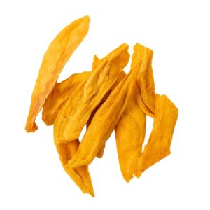 Dried mango slices scattered on a white background bright orange in color